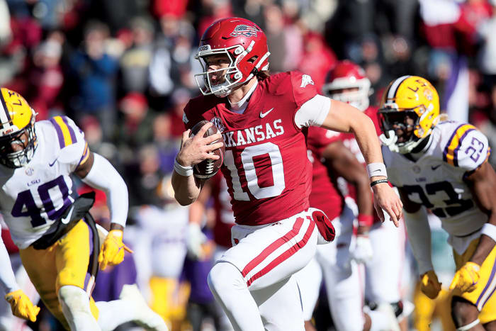 Arkansas quarterback Cade Fortin rushes against the LSU Tigers.